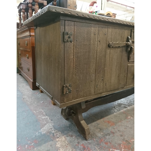 215B - A Nigel Griffiths carved oak sideboard - approx. 76cm high x 168cm wide x 46cm deep