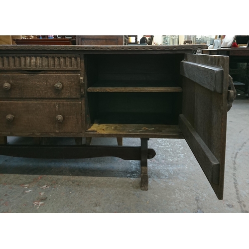 215B - A Nigel Griffiths carved oak sideboard - approx. 76cm high x 168cm wide x 46cm deep