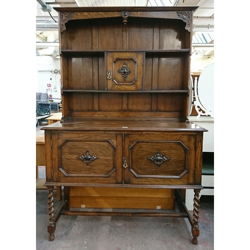 217 - An early 20th century carved oak dresser on barley twist supports - approx. 185cm high x 122cm wide ... 