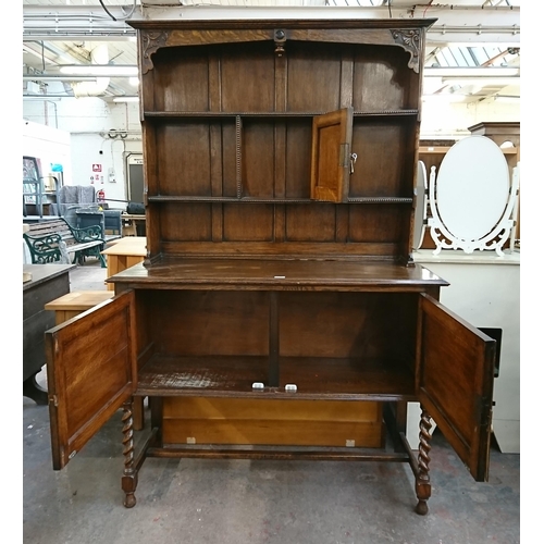 217 - An early 20th century carved oak dresser on barley twist supports - approx. 185cm high x 122cm wide ... 