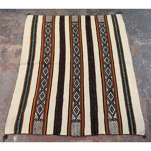 225 - A mid 20th century hand woven rug - approx. 172cm x 154cm