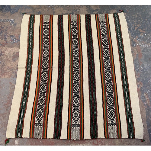 225 - A mid 20th century hand woven rug - approx. 172cm x 154cm