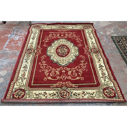 226A - A Turkish Tapiso Atlas red ground machine woven rug - approx. 243cm x 180cm