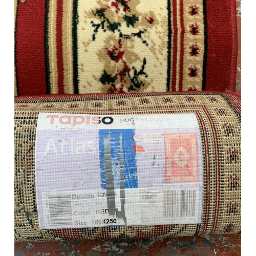 226A - A Turkish Tapiso Atlas red ground machine woven rug - approx. 243cm x 180cm