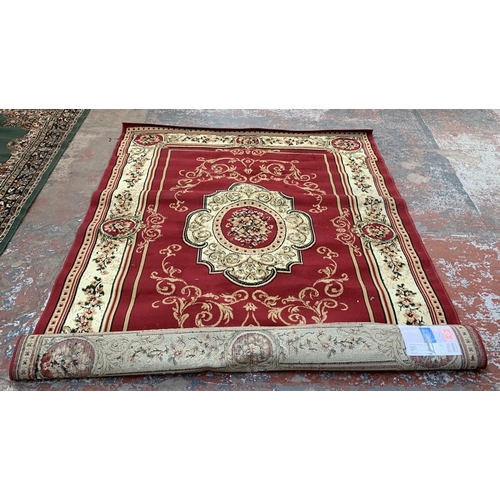 226A - A Turkish Tapiso Atlas red ground machine woven rug - approx. 243cm x 180cm