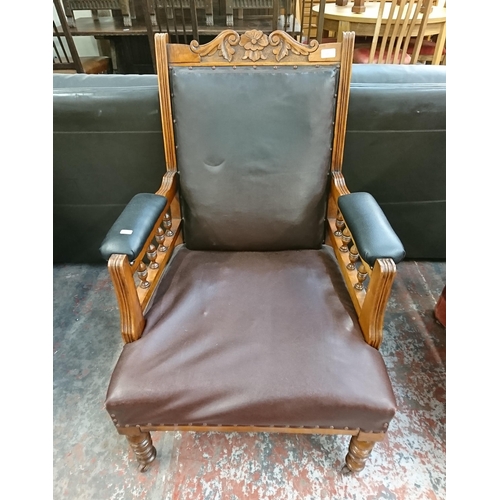 231 - A late Victorian/Edwardian carved walnut and vinyl upholstered parlour chair