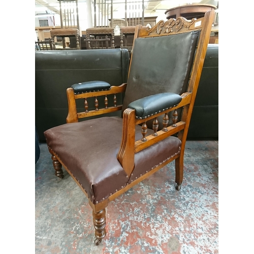 231 - A late Victorian/Edwardian carved walnut and vinyl upholstered parlour chair