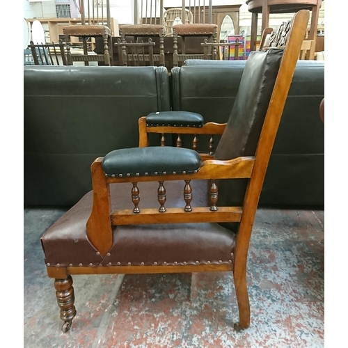 231 - A late Victorian/Edwardian carved walnut and vinyl upholstered parlour chair