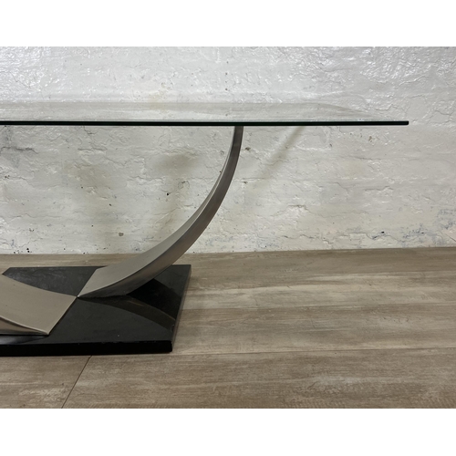 235 - A modern glass top coffee table on metal pedestal base - approx. 47cm high x 71cm wide x 126cm long