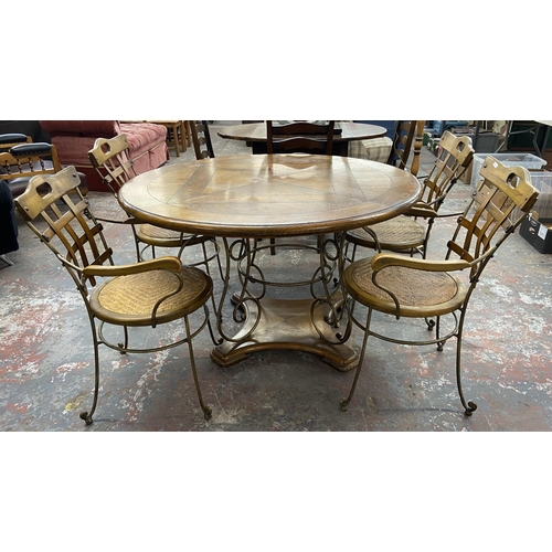 235A - A pine and wrought metal circular dining table and four rattan seated chairs - approx. 75cm high x 1... 