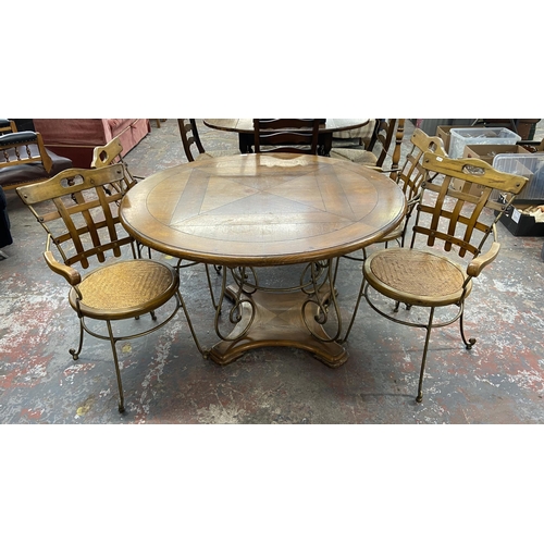 235A - A pine and wrought metal circular dining table and four rattan seated chairs - approx. 75cm high x 1... 