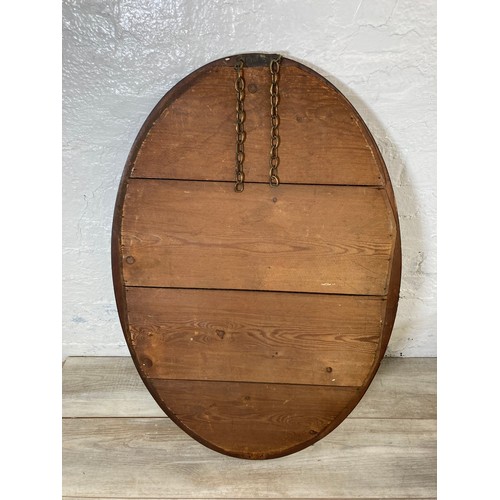 260 - An Edwardian inlaid mahogany framed bevelled edge oval wall mirror - approx. 92cm high x 60cm wide