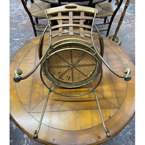 235A - A pine and wrought metal circular dining table and four rattan seated chairs - approx. 75cm high x 1... 