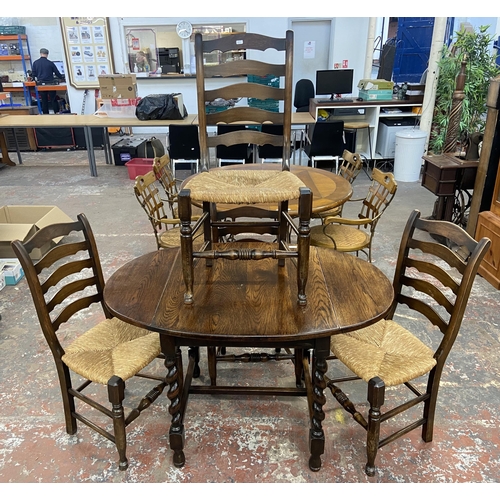 236 - An early 20th century oak drop leaf barley twist dining table and four 19th century style beech and ... 