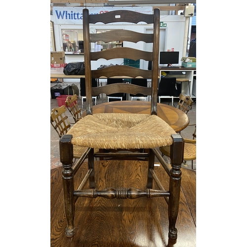 236 - An early 20th century oak drop leaf barley twist dining table and four 19th century style beech and ... 