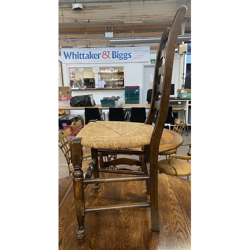 236 - An early 20th century oak drop leaf barley twist dining table and four 19th century style beech and ... 