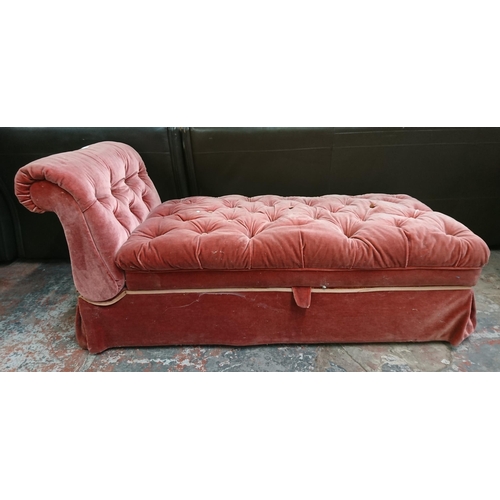 238 - An early 20th century pink buttoned fabric upholstered drop arm chaiselongue/ottoman - approx. 74cm ... 