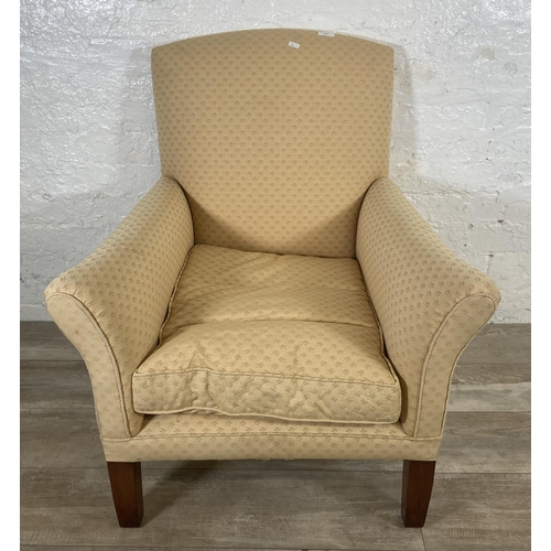 239 - A mid 20th century W. H. Barlow Huyton Quarry fabric upholstered and beech armchair