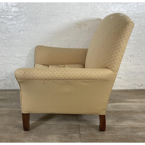 239 - A mid 20th century W. H. Barlow Huyton Quarry fabric upholstered and beech armchair