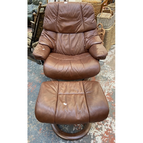 242A - An Ekornes Stressless cognac brown leather and beech swivel reclining armchair and footstool