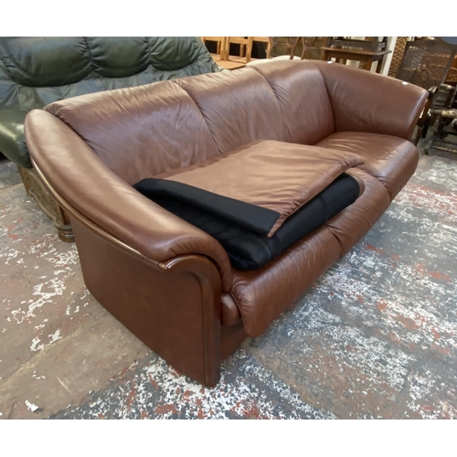 242B - An Ekornes stressless cognac brown leather and beech three seater sofa with new seat cushion