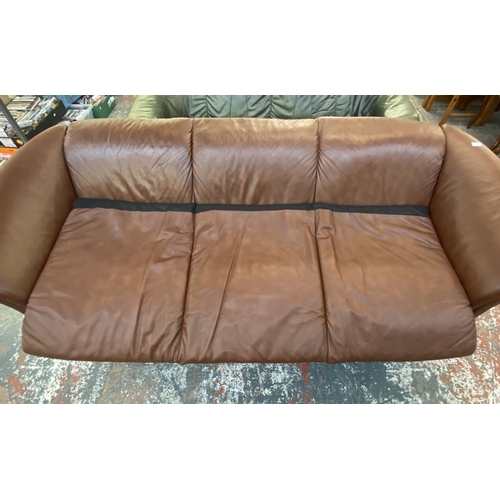 242B - An Ekornes stressless cognac brown leather and beech three seater sofa with new seat cushion