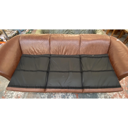 242B - An Ekornes stressless cognac brown leather and beech three seater sofa with new seat cushion