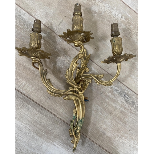 244 - Two pairs of Rococo style gilt metal wall sconces