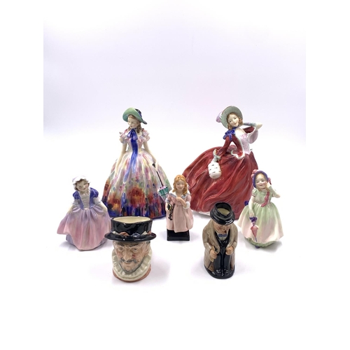 330 - Seven Royal Doulton figurines and character jugs, Easter Day HN2039, Autumn Breezes HN1934, Dinky Do... 