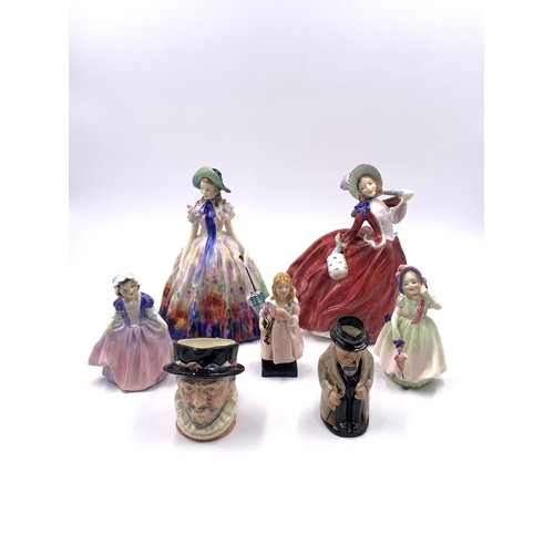 330 - Seven Royal Doulton figurines and character jugs, Easter Day HN2039, Autumn Breezes HN1934, Dinky Do... 