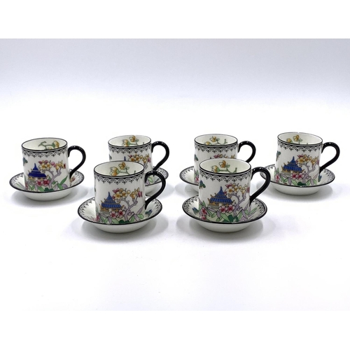 338 - A 1930s Royal Doulton Pagoda pattern twelve piece coffee set comprising six cups and six saucers on ... 