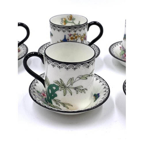 338 - A 1930s Royal Doulton Pagoda pattern twelve piece coffee set comprising six cups and six saucers on ... 