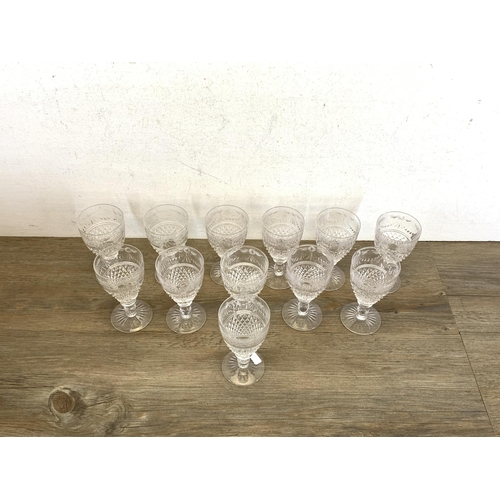 342 - Twelve Stuart Beaconsfield cut crystal sherry/port glasses - approx. 13cm high