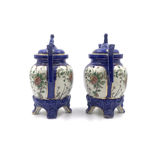 347 - A pair of Oriental hand painted porcelain twin handled ginger jars and covers - approx. 21cm high