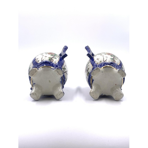 347 - A pair of Oriental hand painted porcelain twin handled ginger jars and covers - approx. 21cm high