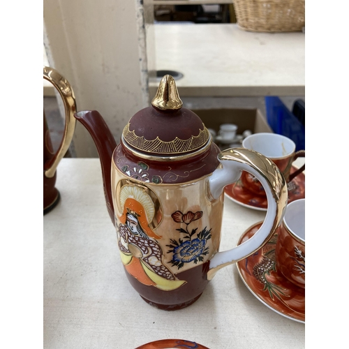 378 - A collection of Japanese Satsuma porcelain to include two coffee pots, eight cups, twelve saucers et... 