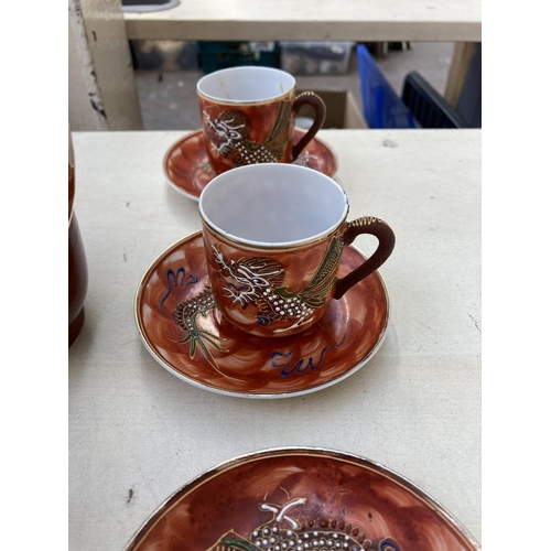 378 - A collection of Japanese Satsuma porcelain to include two coffee pots, eight cups, twelve saucers et... 