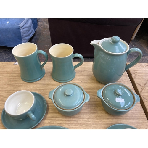 371 - A collection of Denby Manor Green stoneware dinnerware