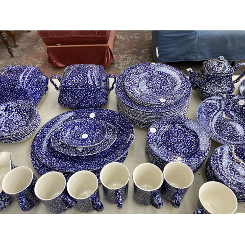 374 - A collection of Calico pattern dinnerware