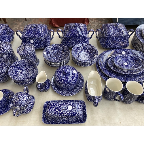 374 - A collection of Calico pattern dinnerware