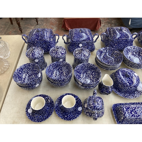 374 - A collection of Calico pattern dinnerware