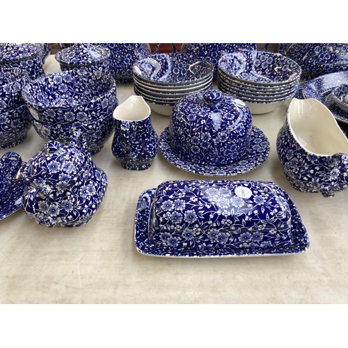 374 - A collection of Calico pattern dinnerware