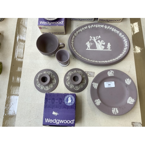 381 - Twelve pieces of Wedgwood lilac Jasperware to include boxed ring stand, boxed fluted candlestick, cu... 