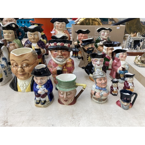 385 - Twenty three ceramic character and Toby jugs to include Wood Potters of Burslem, Royal Doulton, Besw... 