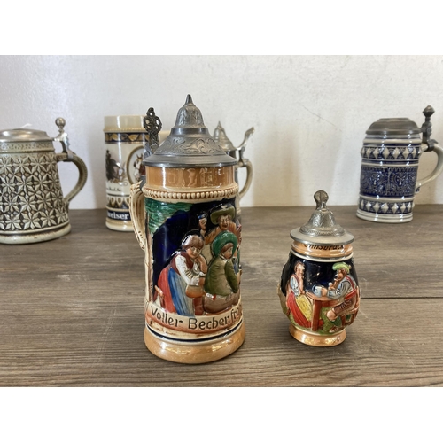 387 - Eight German ceramic Steins