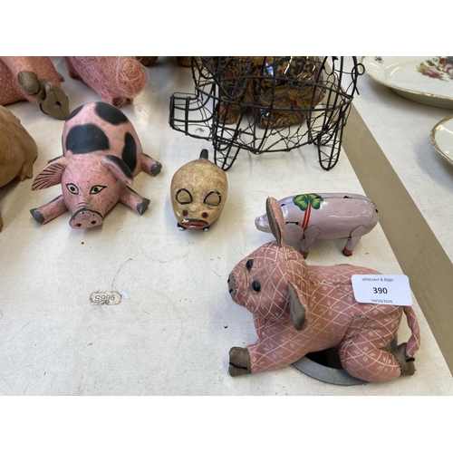 390 - Fourteen various pig figurines and ornaments to include Tin Treasures tinplate clockwork toy, Dora D... 