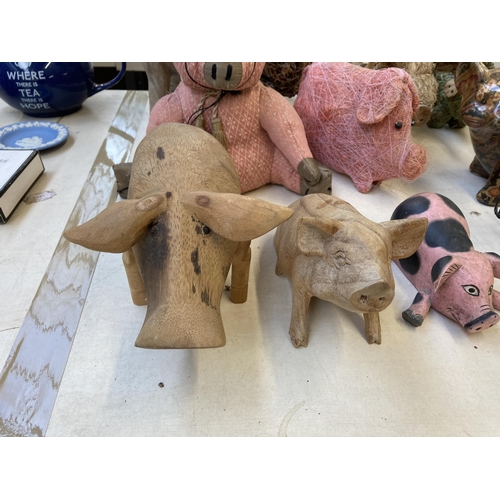 390 - Fourteen various pig figurines and ornaments to include Tin Treasures tinplate clockwork toy, Dora D... 