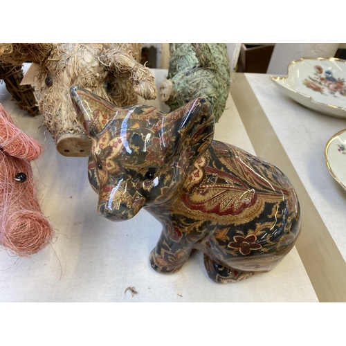 390 - Fourteen various pig figurines and ornaments to include Tin Treasures tinplate clockwork toy, Dora D... 