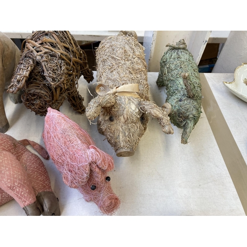 390 - Fourteen various pig figurines and ornaments to include Tin Treasures tinplate clockwork toy, Dora D... 