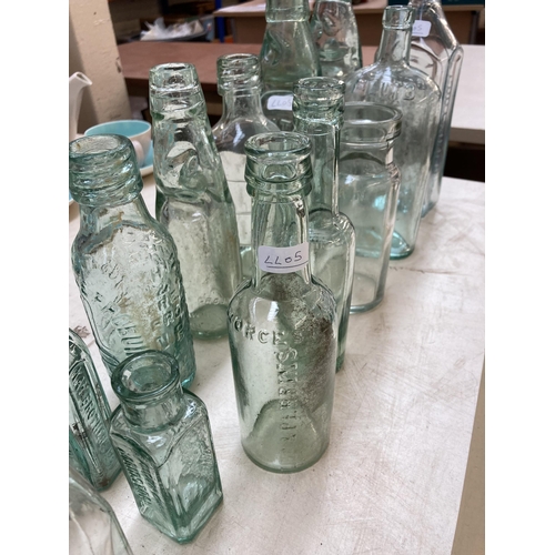 393 - Twenty vintage glass bottles